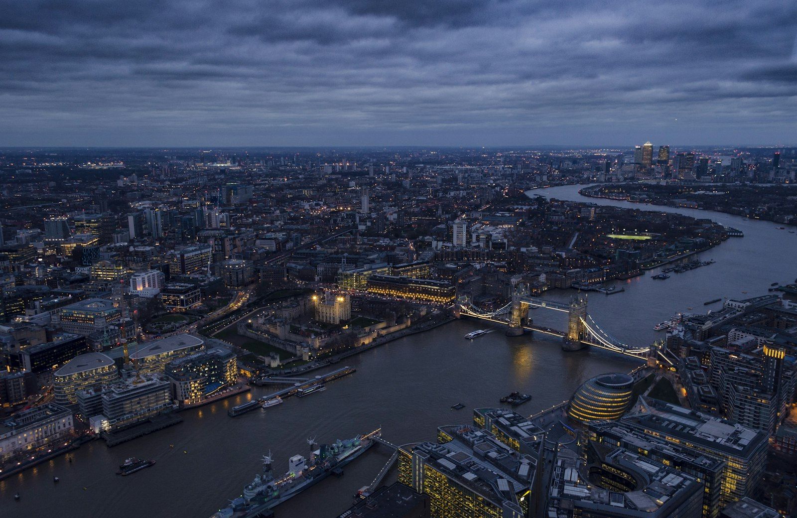 Aerial view of the River Thames and Tower Bridge at dusk